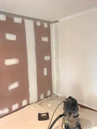 Resilient Mounts, Furring Channels, then Barrierboard is hung and installed to block noise between adjoining rooms.