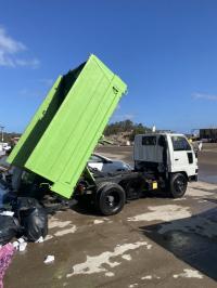 Rubbish Rocket truck unloading waste at the Terry Hills recycling center in Sydney.